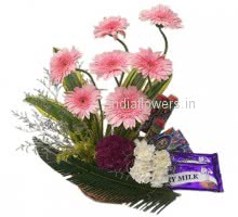 Tray with pink gerberas ,crysanthimums and carnations with chocolates to India