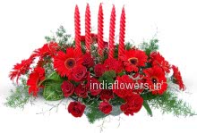 Hall Center piece 4 curly Candles Mixed with Red Roses Carnation and Gerberas to India