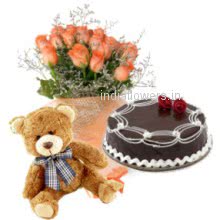 Bunch of 20 Orange Roses. Half kg Chocolate cake. 12 inches Teddy to India