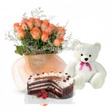 Bunch of 20 Orange Roses, Half Kg. Chocolate Cake and 6 Inch Teddy. to India