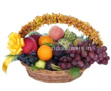An arrangement of mixed fruits and flowers with a ribbon bow, A wonderful gift.