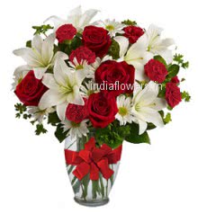 Glass vase with 5 PC Asiatic White Lilies, 10 Red Roses, 10 Red Carnation and 10 Whit Gerberas with greens