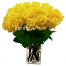 Glass vase with 30 Yellow Roses nicely decorated with greens