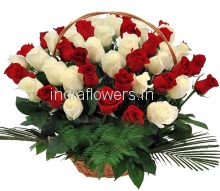 Basket of 25 Red and 25 White Roses nicely decorated with fillers 