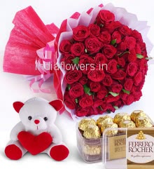 Beautiful Bouquet of 50 Red Roses nicely decorated with fillers ribbons and paper packing, with 6 Inch Teddy and Box of 16pc Fererro Rocher