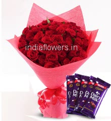 Bunch of 50 Red Roses nicely decorated with paper packing and ribbons and 5 pc Cadbury dairy milk 