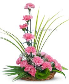 Arrangement of Pink Carnation nicely decorated with fillers and greens