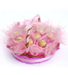 Beautiful Basket of 13pc Ferrero Rocher Chocolate nicely decorated with Pink Net Packing and Ribbons