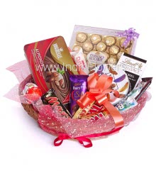 Big Basket of Chocolate Gifts, this basket contains 1 box of vochelle 180g., 24pc Ferrero Rocher Chocolates, 1pc Lindt bar 100g., 1pc Temptation 72g., 2pc Bounty Chocolates 57g., 3pc Rafello, Small box of Danish Cookies 150g., 2pc Twix 50g., 1pc Cadbury Silk 55g., 2pc Mars 51g., 1pc Kinder Joy and 1pc Toblerone Chocolate 50g. nicely decorated with Net and Ribbons 